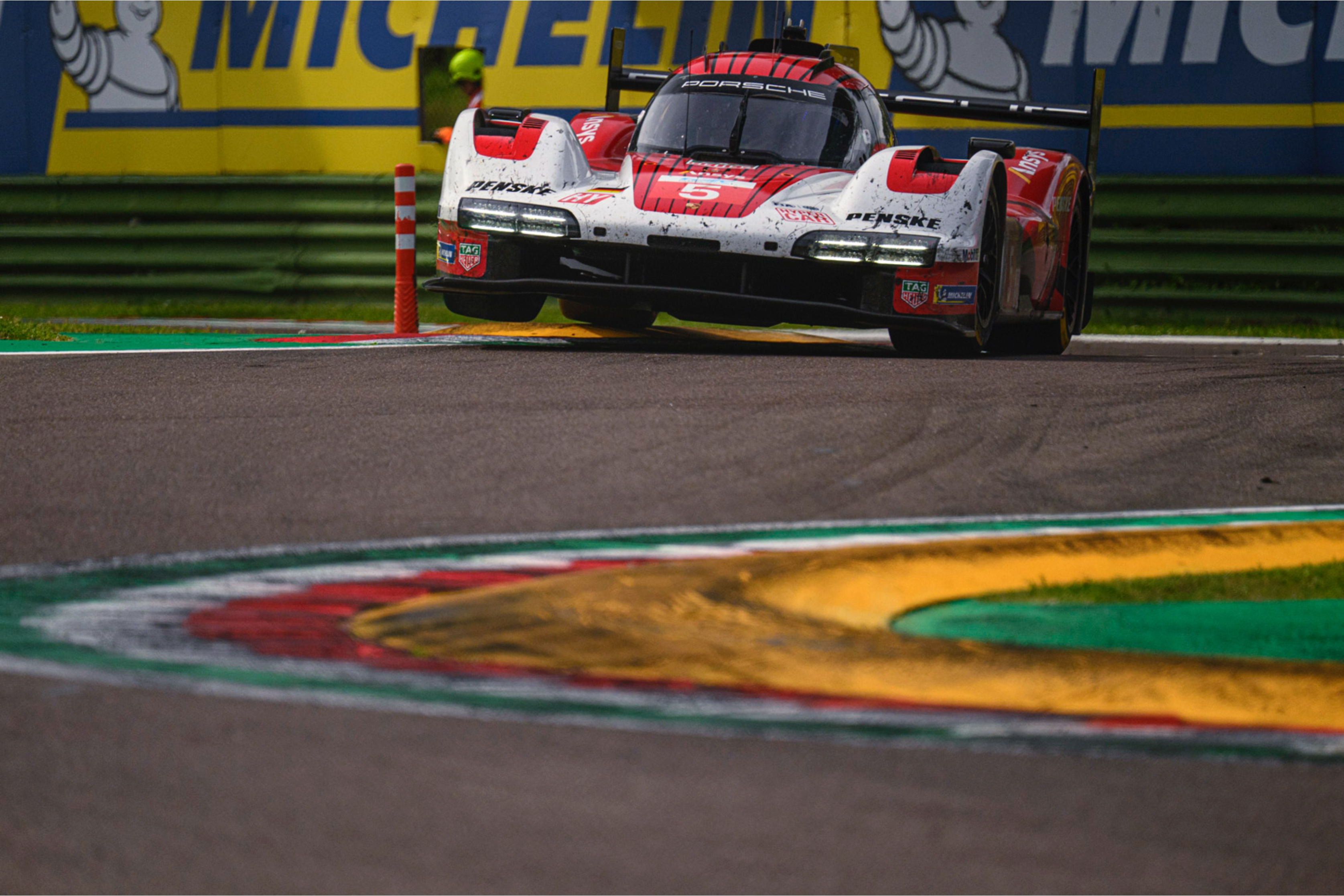 Prototype racing car jumping over kerb at WEC 6 Hours of Imola, photograph by Simone Slawitz